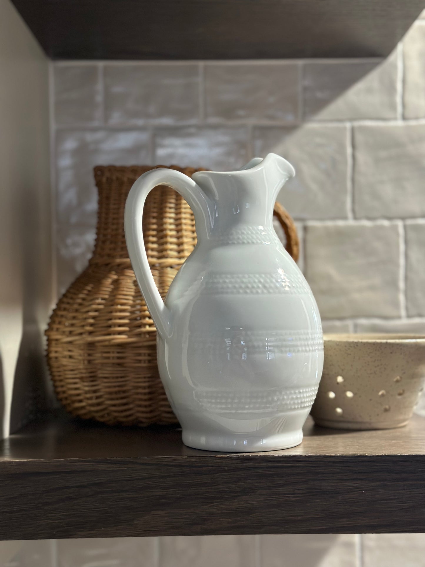 White glass pitcher with handle