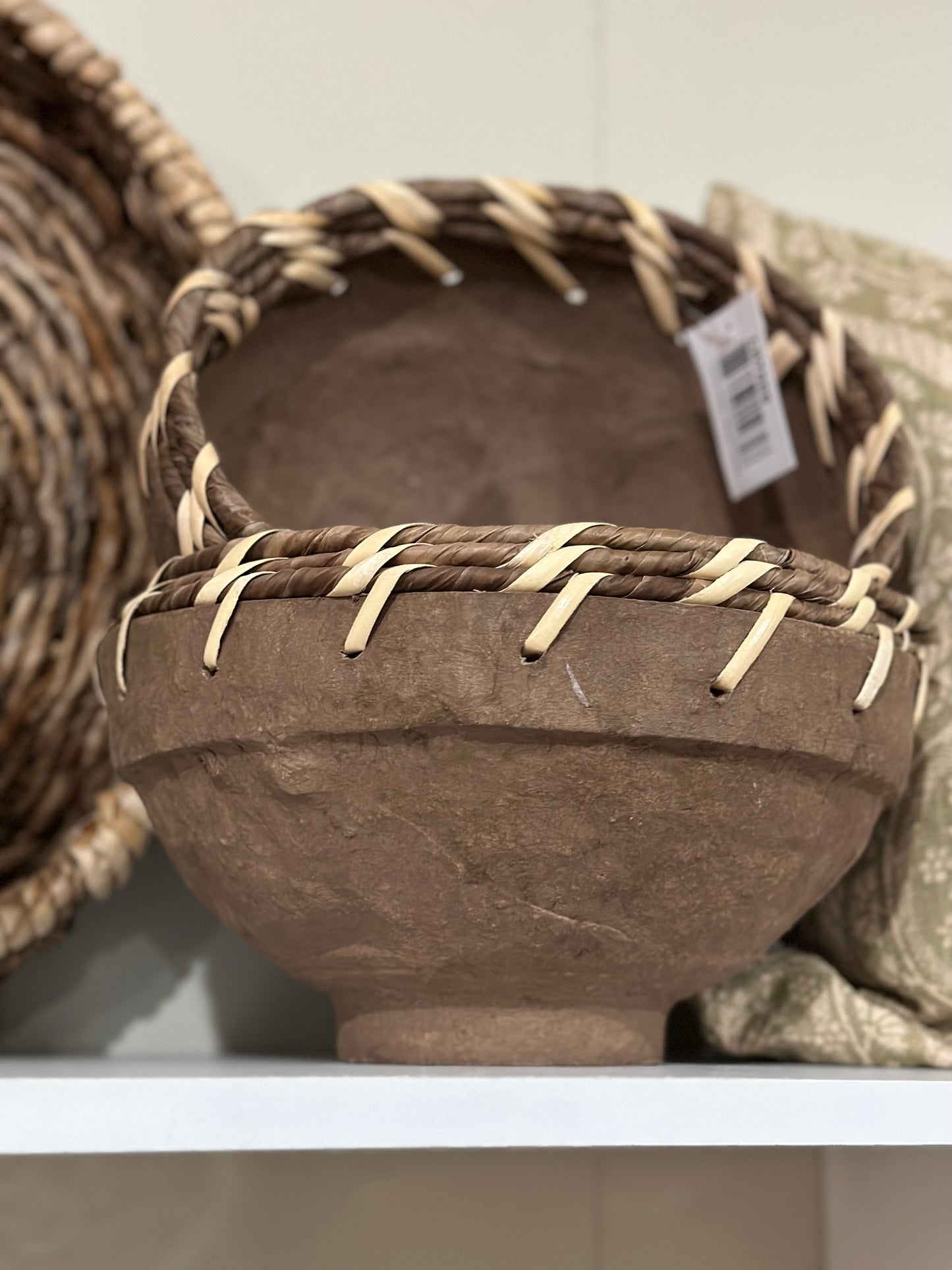 Brown bowl with woven edge