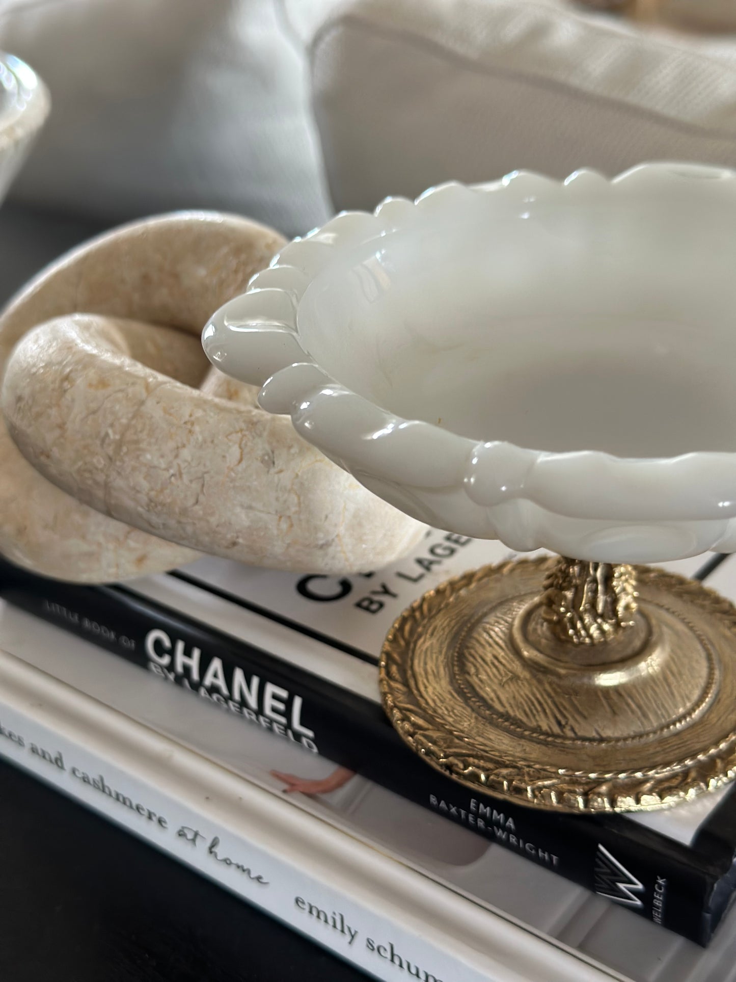 Small white glass dish with gold base