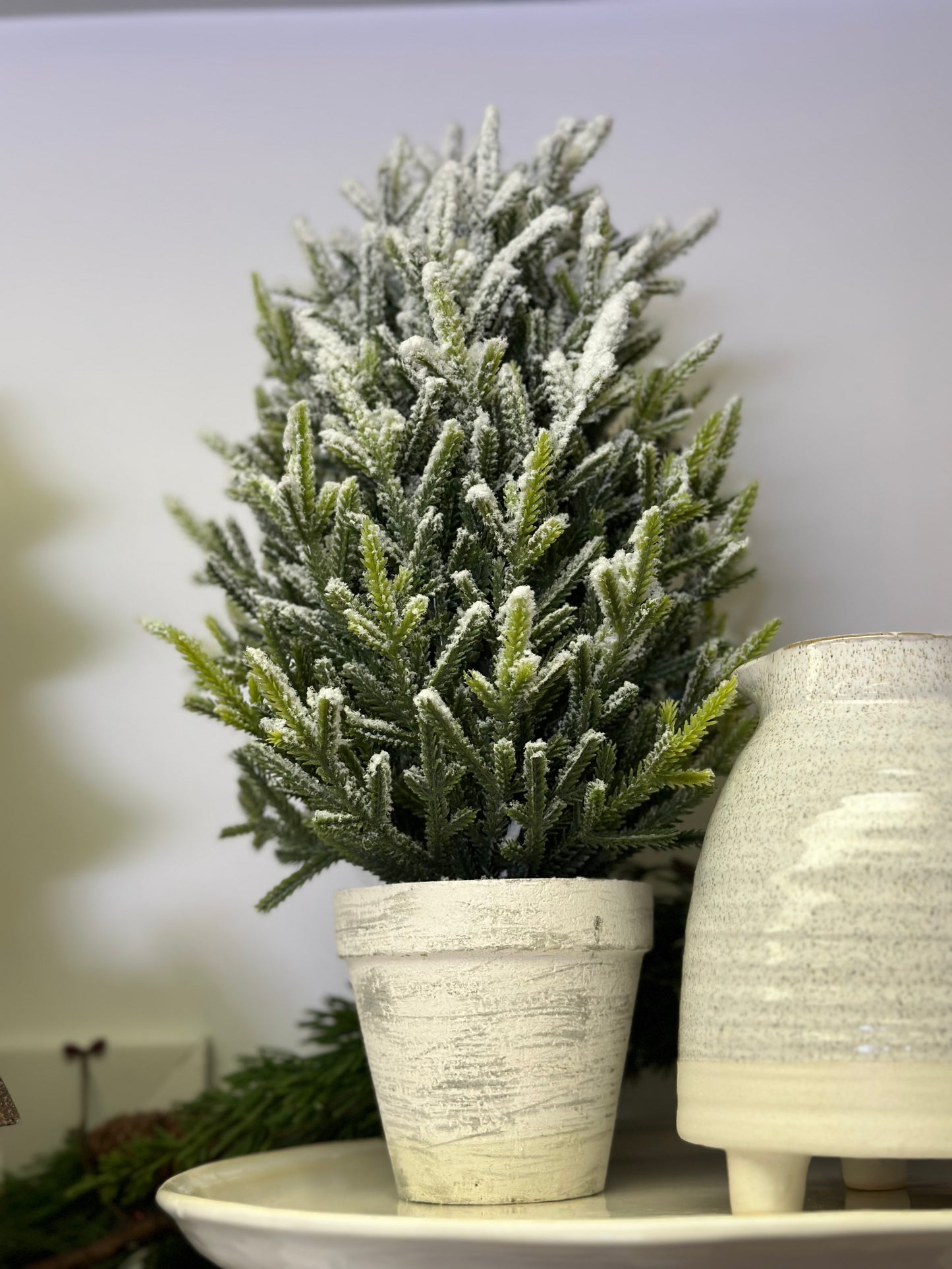 Potted flocked trees in white pot