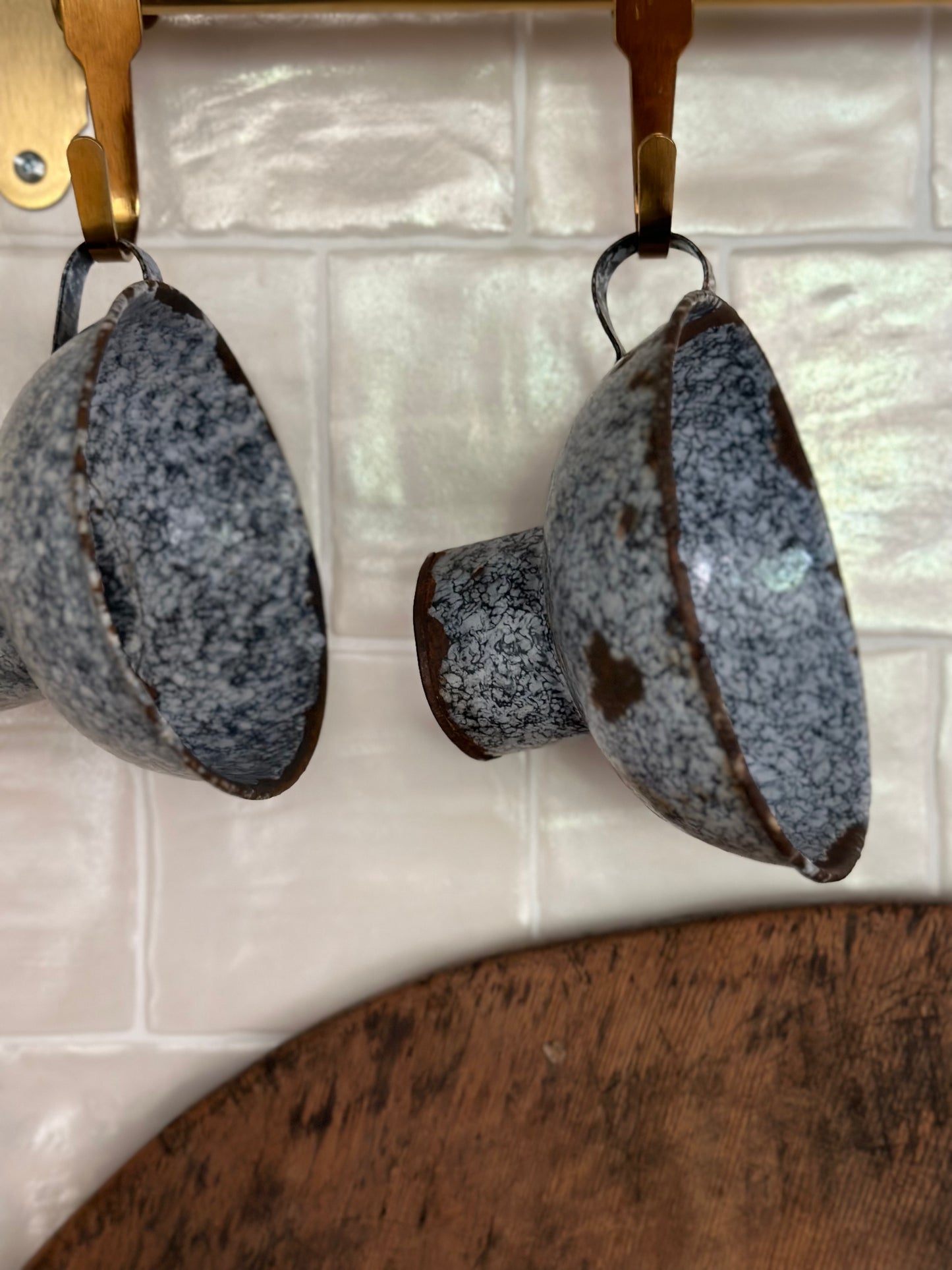 Pair of small blue tin collanders