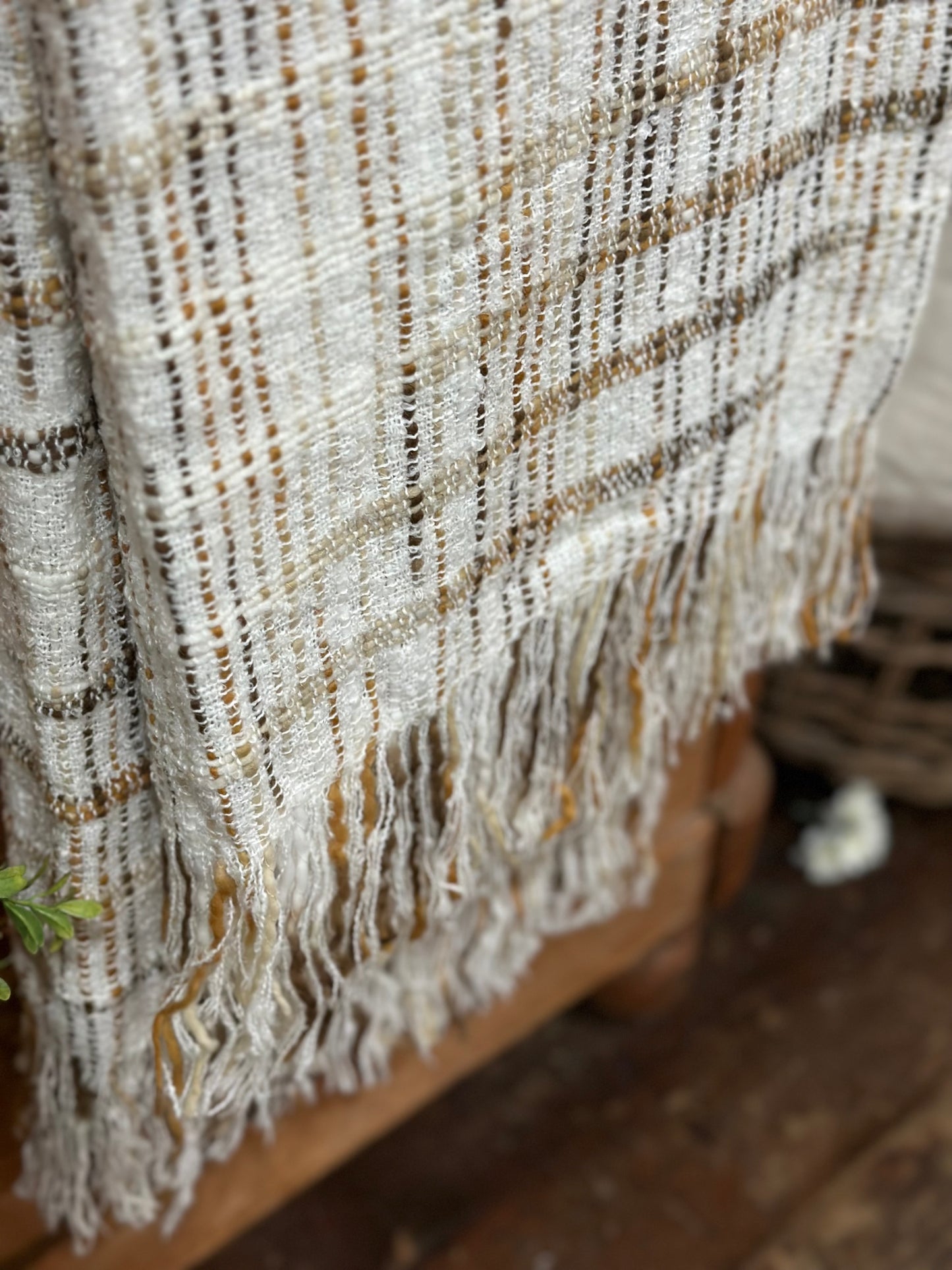 Fringed white throw with brown stripes