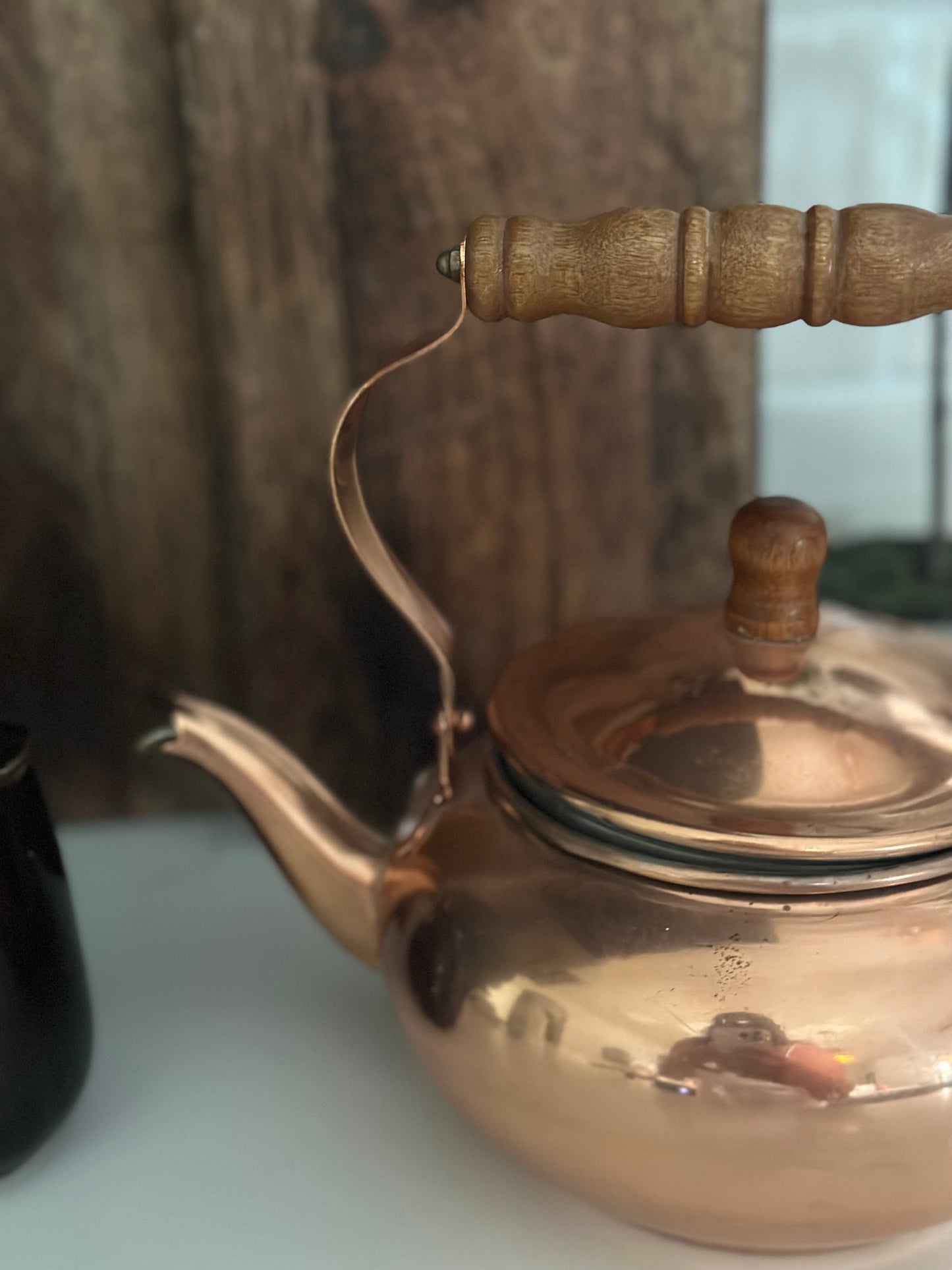 Copper tea pot with wood handle