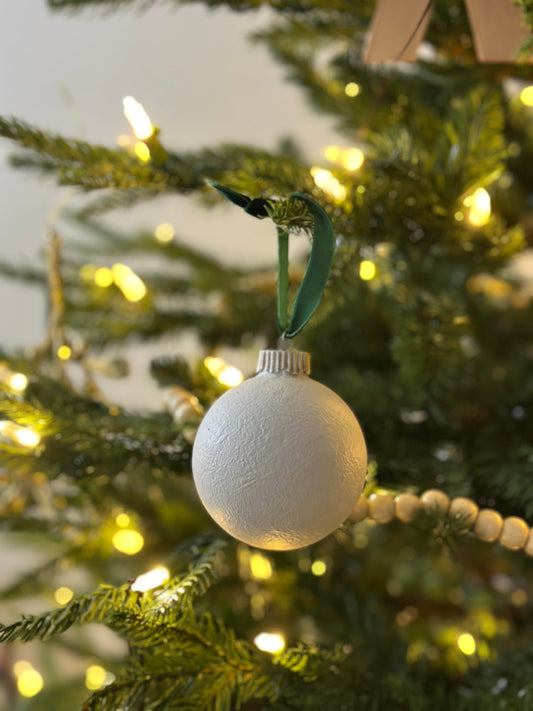 White ornament on string