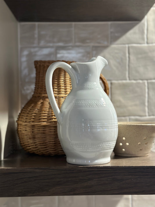 White glass pitcher with handle