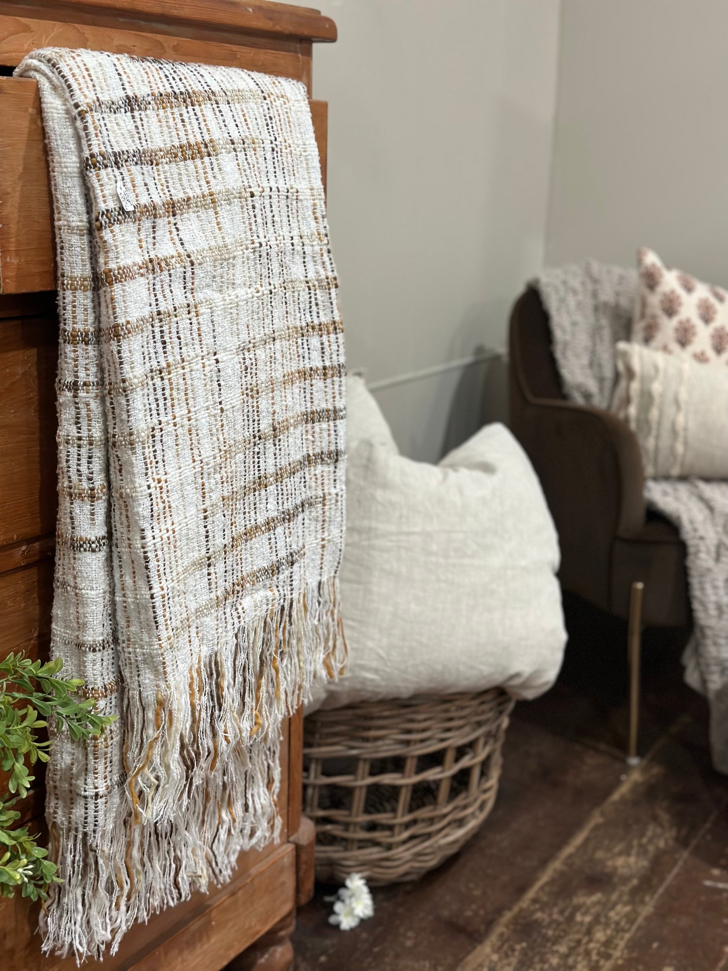 Fringed white throw with brown stripes