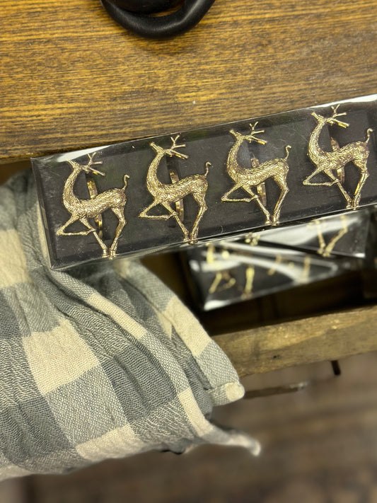 Set of four gold reindeer napkin rings