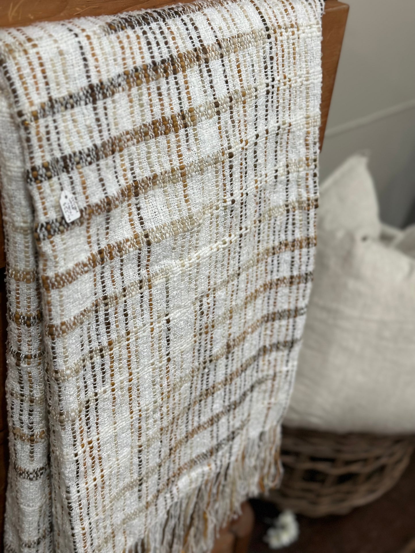 Fringed white throw with brown stripes