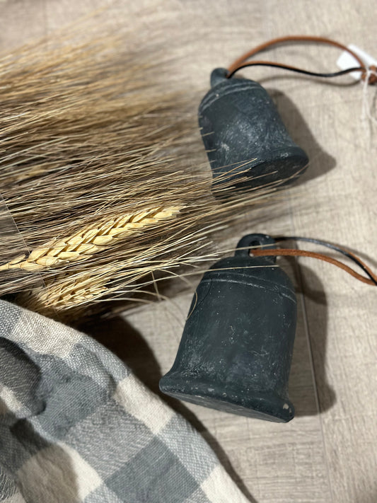 Cement bell on leather string
