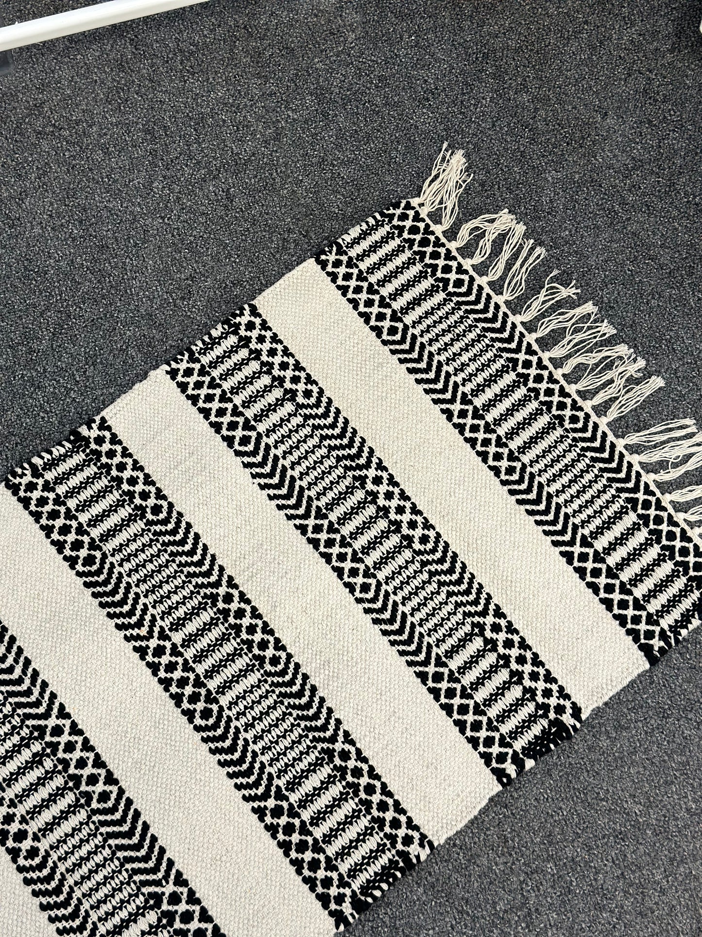 Striped rug with fringes
